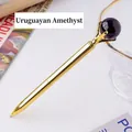 Elegant gold metal ballpoint pen topped with a natural purple amethyst sphere - Uruguayan Amethyst Sphere Style (6186451919094)