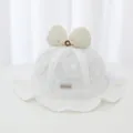 Detailed close-up of a white baby girl lace bucket hat featuring a large butterfly bow - 45-48cm / White