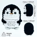 Handmade crochet positive penguin doll holding a motivational card for desk decor - Black Penguin