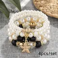 Bohemian 4pcs multilayer faux pearl beaded bracelet set with gold starfish charm dangle - Black