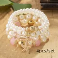 4-piece Bohemian pearl bracelet set with elegant pink beads and golden starfish charm - Pink