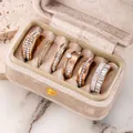 Elegant rose gold stainless steel ring set with rhinestones in a velvet jewelry box. - 6-Piece Ring Set