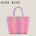 Colorful handmade woven plastic tote bag with pink and blue checkered pattern for picnic. - Pink