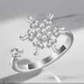 Macro view of a luxury adjustable silver-plated ring with a snowflake zircon design. - Adjustable Open / Baguette Snowflake Rotating Style