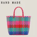 Colorful checkered plastic hand-woven picnic tote bag with vibrant handle - Red and Green