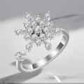 Detailed view of silver-plated rotating ring featuring a large sparkling zirconia snowflake motif - Adjustable Open / Snowflake Rotating Style