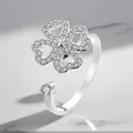 Close-up of adjustable silver-plated rotating ring with sparkling zircon clover design - Adjustable Open / Clover Rotating Style