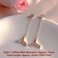 Detail view of mermaid tail drop earrings with shimmering white shell and cubic zirconia stones. - Natural Pearl / Mermaid Tail White Mother of Pearl Artificial Pearl Style (EH66-7)