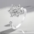 Detailed macro view of an adjustable silver-plated rotating ring with sparkling zircons - Adjustable Open / Hexagram Rotating Style