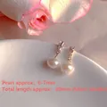 Elegant close-up of natural freshwater pearl earrings featuring sparkly zircon stones - Natural Pearl / Geometric Zirconia & Artificial Pearl Dangle Style (EH66-9)