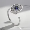 Close-up of a silver adjustable evil eye ring featuring blue and clear zircon stones - Adjustable Open / Evil Eye Rotating Style (Silver)