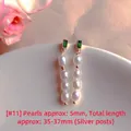 Detail view of elegant freshwater pearl drop earrings with green rectangular stones - Natural Pearl / Green Zirconia Vertical Artificial Pearl Style (EH66-11)