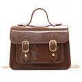 Elegant brown glossy jelly Cambridge handbag featuring a stylish gold chain strap - Coffee