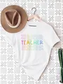 Creative colorful TEACHER typography print on a minimalist white women's casual T-shirt - S / Tops / White Rainbow Teacher Repeat Print (6)