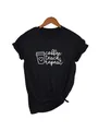 Close-up of 'coffee teach repeat' white print on a black casual cotton T-shirt - S / Tops / Black Coffee Teach Style (14)