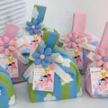 Soft blue and green knitted mini wrist gift bag featuring a cute cloud pattern design - 16x28cm / Blue-Green Striped Cloud Flower (With Ribbon/Blue Flower)