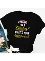Detail view of a black women's T-shirt with 'I'M A Teacher' floral graphic print. - S / Tops / Black Floral Superpower Style (30)
