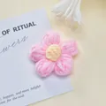 Handmade pink crochet flower accessory with yellow center shown on a minimalist card - Single Piece / Pink Puff Flower Accessory