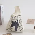 Cute knitted knot wrist bag with pixel cat pattern in cream and black finish - 16x28cm / Beige Base Multi-Face Cat