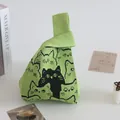 Charming green knitted wrist bag featuring a cute black and green cat pattern print - 16x28cm / Green Base Multi-Face Cat