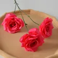 Three realistic magenta artificial velvet roses displayed on a decorative beige tray - 3-Head Diamond Rose Freud