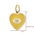 Macro view of a gold-plated heart pendant featuring a yellow evil eye enamel design - Yellow Evil Eye Heart (BXGPJ263)