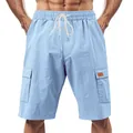Close-up showing the texture and drawstring of light blue linen cargo shorts for men. - Light Blue
