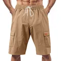 Detailed close-up view of men's breathable khaki linen cargo shorts with drawstring waistband. - Khaki/Earth Yellow