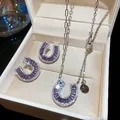 Elegantes Hufeisen-Schmuckset mit lila Baguette-Steinen in einer weißen Geschenkbox - Lila Baguette-Zirkonia-Hufeisen-Schmuckset (35#) / Silber/Lila