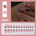 Detalle de 24 uñas postizas rosas estilo francés con purpurina plateada y estampado. - Estilo de impresión de cebra negro con purpurina plateada (DFX-0010)