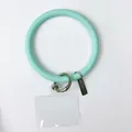 Mint green silicone wristlet keychain with clear phone patch and metal ring - Pale Cyan