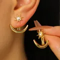 Vintage golden starburst and crescent moon earrings featuring a sparkling center stone - KC Gold (WG-0821)