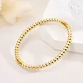 Elegant 18K gold plated stainless steel round bead bangle bracelet with white spacers - White Bead Bangle