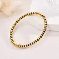 Elegant 18K gold plated stainless steel round bead bracelet with minimalist black accents - Black Bead Bangle