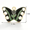 Butterfly enamel jewelry charm in black with floral pattern measuring 2.8cm x 1.8cm - Black Lily of the Valley Butterfly