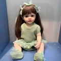 Detailed view of a realistic reborn doll wearing green knitted clothes and headband - Green Sweater Brown Hair Chubby / Doll Clothes (Outfit Only)