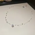 Gros plan élégant d'un collier ras du cou minimaliste à deux couches avec perles et zircone - Style 32 (Ligne de Pêche Double Rangée Perle Zircon) / Argent