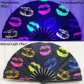 10-inch UV fluorescent folding fan with colorful kiss pattern and bamboo ribs. - Lip Prints UV Glow A84