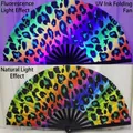 33cm leopard print rainbow folding fan with bamboo frame showing UV and natural light effects - Colorful Leopard UV Glow A77