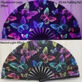 10-inch bamboo folding fan with butterfly pattern and UV fluorescent ink effect comparison - Butterfly Print UV Glow A78