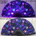 33cm bamboo folding hand fan featuring UV reactive neon fox and floral pattern motifs - Fox Mask & Floral UV Glow A79