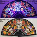 10-inch bamboo folding fan featuring UV fluorescent skull and floral prints for festivals - Day of the Dead Skull UV Glow A82