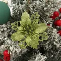 Detailed view of green glitter hollow 9cm Christmas flower on a tree - Army Green