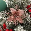 Macro view of a 9cm rose gold hollow glitter poinsettia flower for Christmas tree decor - Rose Gold