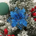 Close-up of a blue glittery hollow-out poinsettia Christmas tree decoration - Royal Blue