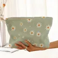 Detailed view of the sage green corduroy makeup bag featuring a white daisy floral print - Green White Daisy (QN154244)