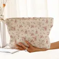 Macro view of corduroy makeup bag with pink floral pattern and zip closure. - Cream Pink Small Flower (YV59974)
