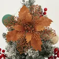Detailed macro shot of a bronze glitter artificial poinsettia Christmas flower decoration - Light Bronze