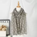 Elegant grey polka dot Bali yarn scarf shawl for women displayed on a mannequin - 180cm x 85cm / Gray