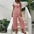 Tuta intera rosa a maniche corte con scollo a V e gamba larga da donna - Rosa